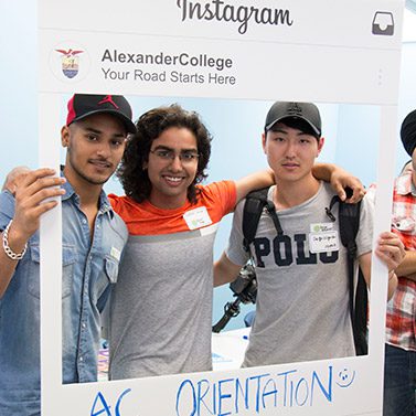 Students posing for the camera during Student Orientation at Alexander College