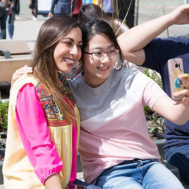Students taking selfies and making friends