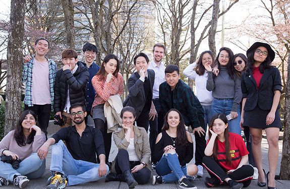 A group of happy international students posing at Alexander College Campus