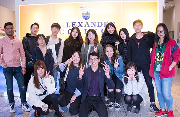 Group of Happy Students Posing for the Camera at Alexander College