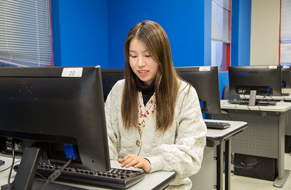 Student Using Computer at Alexander College