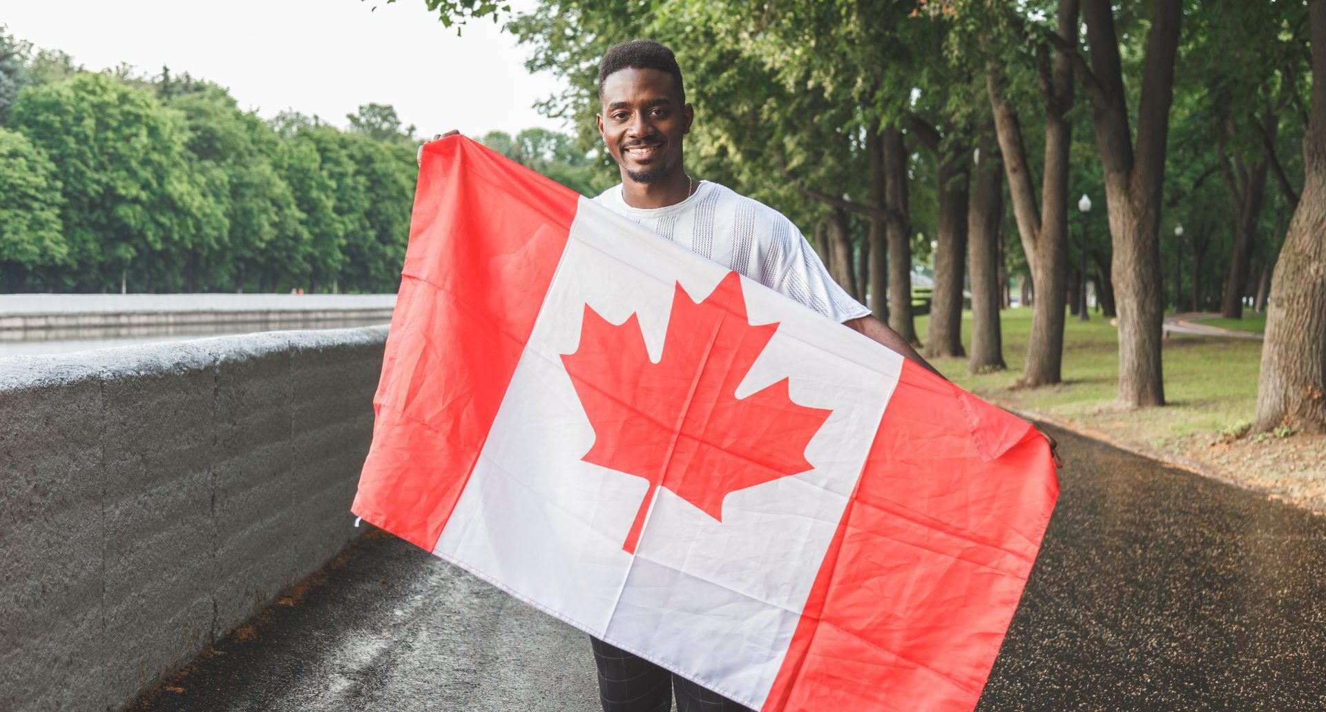 Man Holding Canadian Flag